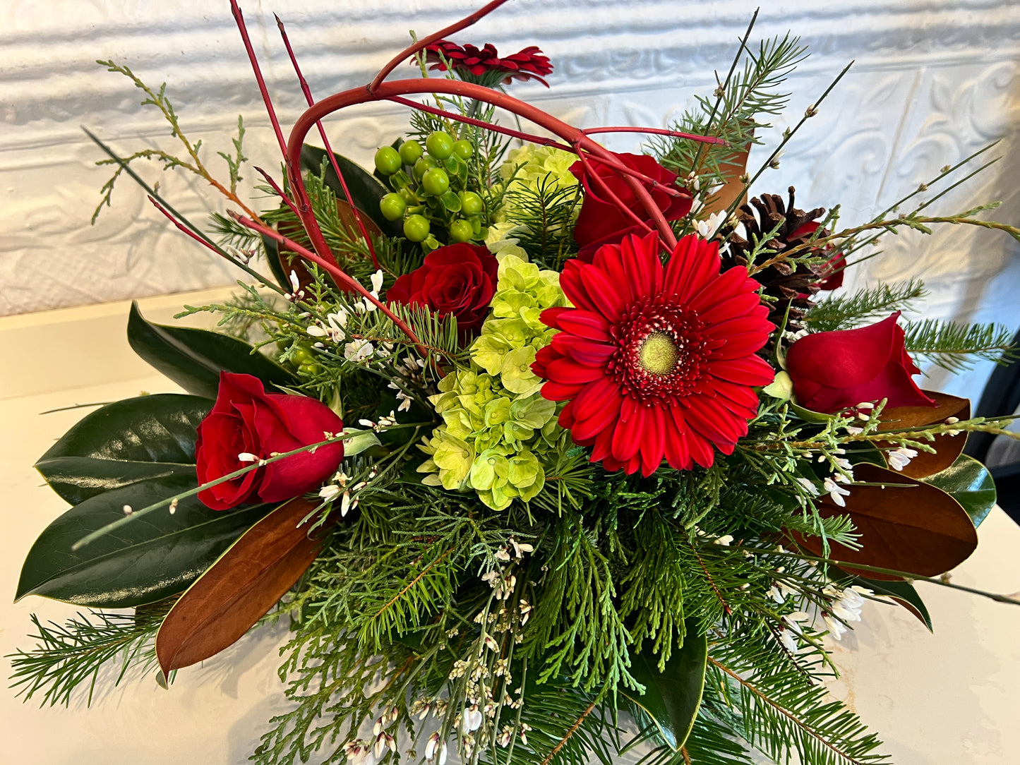 Holiday Arrangement with Winter Greens and Roses