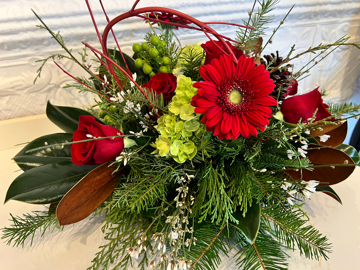 Holiday Arrangement with Winter Greens and Roses