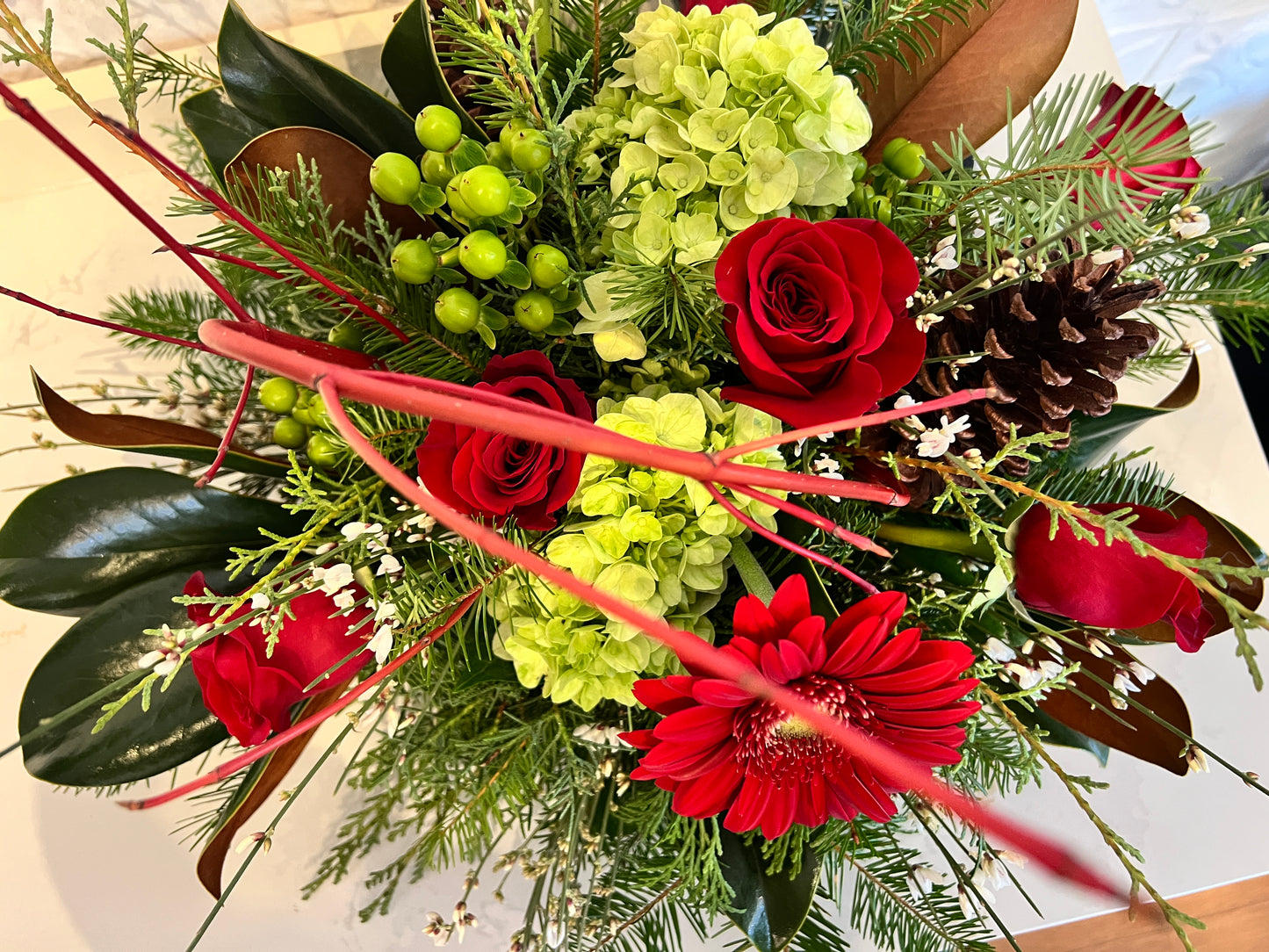 Holiday Arrangement with Winter Greens and Roses